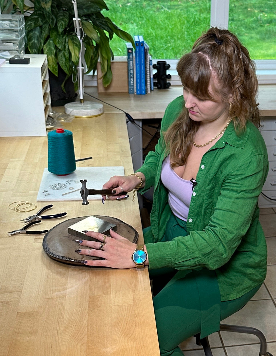 Twyla making a piece of custom jewelry in her seattle studio